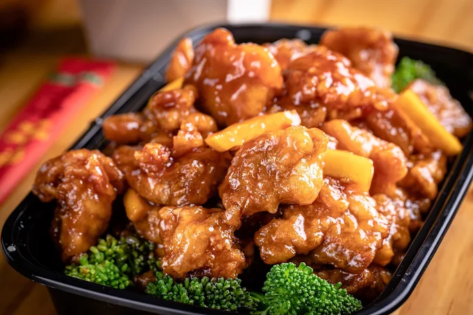 Crisp chicken coated in a glossy sauce with vegetables