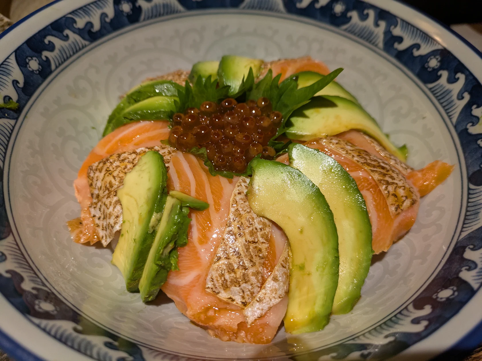 Seared salmon and avocado over rice with ikura